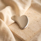 Colder Mornings gua sha board - lifestyle stone slab and linen