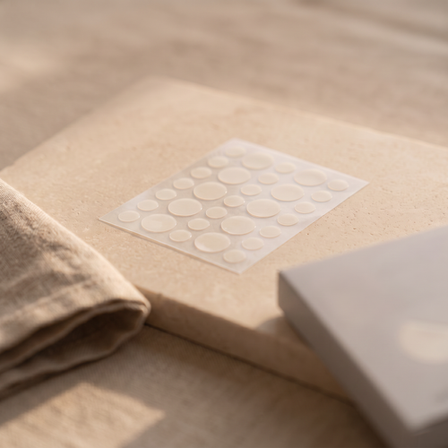 Colder Mornings acne patch - lifestyle stone slab and linen